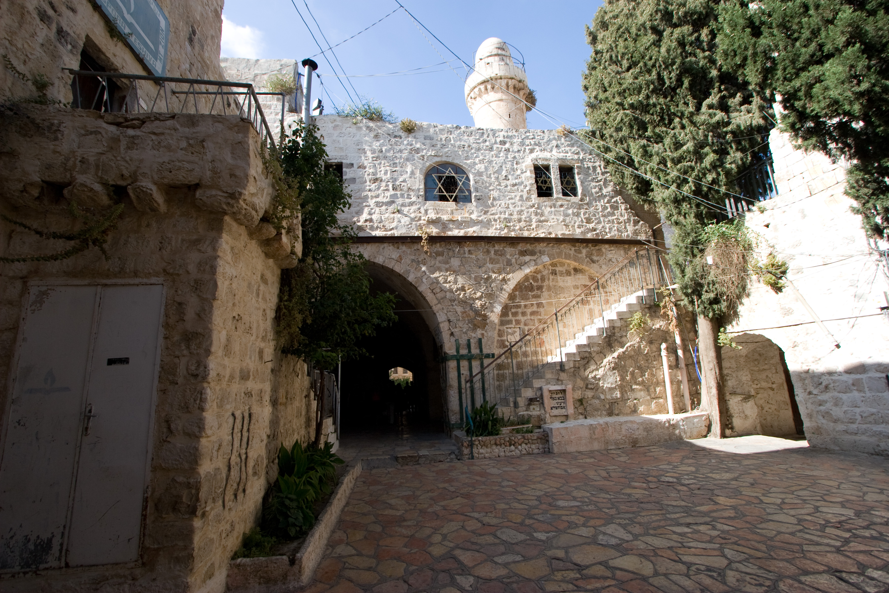 Building with a minaret behind it in the Old City
